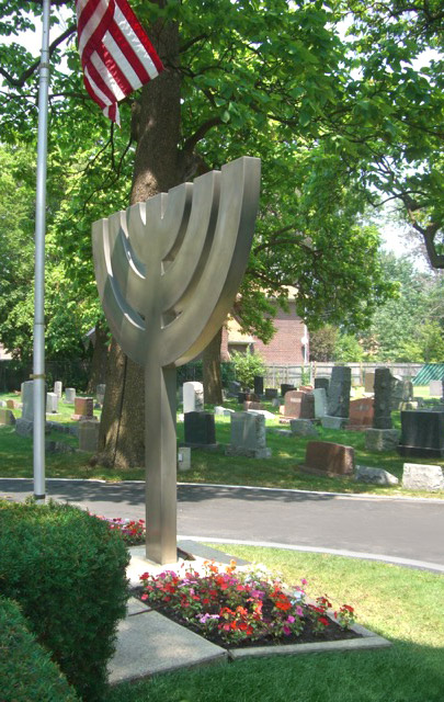 Menorah sculpture and American flag, New Light Cemetery